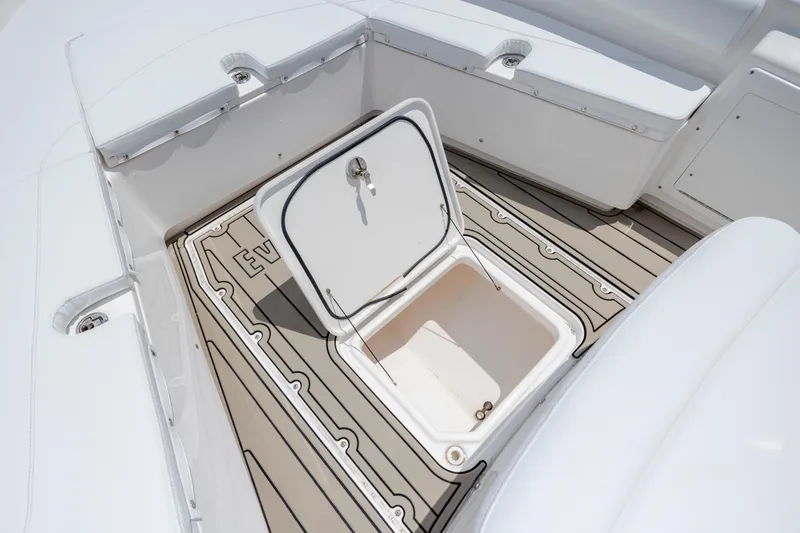 Slide: The Image of 2015 Everglades 243 Center Console boat with open storage compartment on deck. - 26