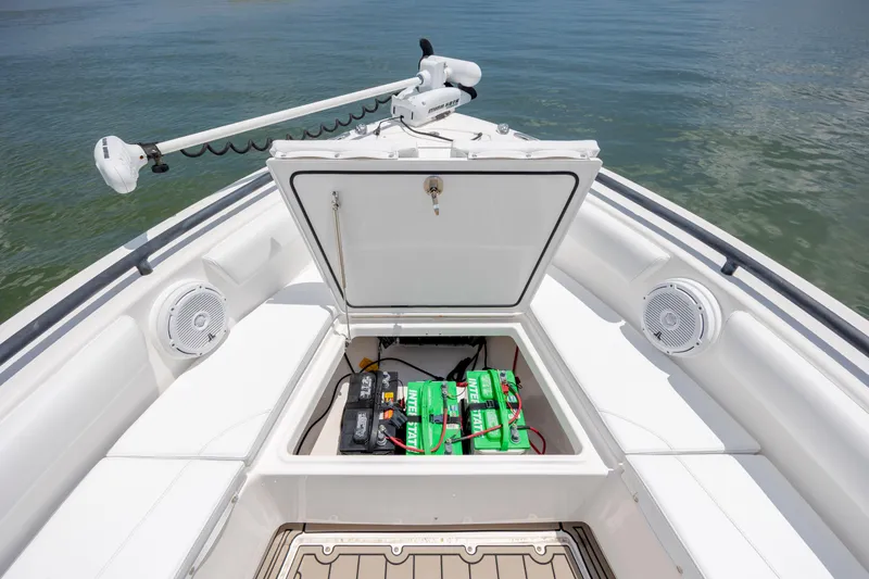 Slide: The Image of 2015 Everglades 243 Center Console boat with open storage compartment and batteries. - 28