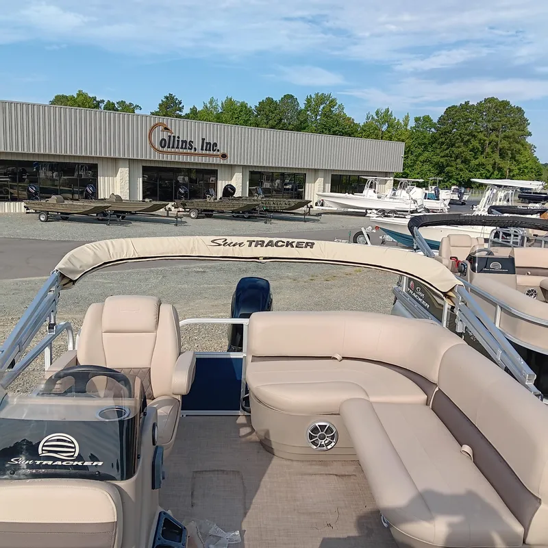 Slide: The Image of 2025 Sun Tracker Bass Buggy 16 XL Select pontoon boat at dealership. - 11
