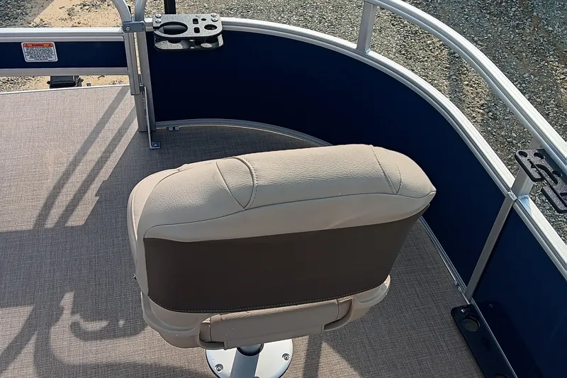 Slide: The Image of 2025 Sun Tracker Bass Buggy 16 XL Select boat seat with cup holders and railing. - 6
