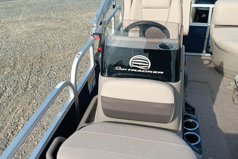 Slide: The Image of 2025 Sun Tracker Bass Buggy 16 XL Select boat interior with steering console and seating. - 7