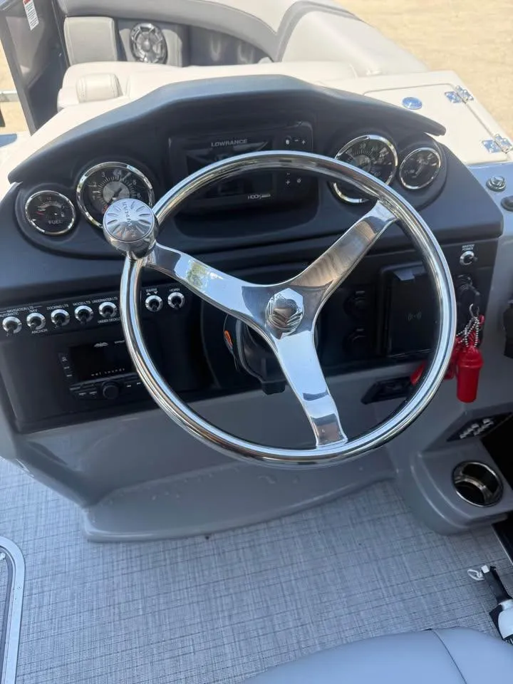 Slide: The Image of Steering wheel and dashboard of 2025 Berkshire 22RFX CTS boat. - 7