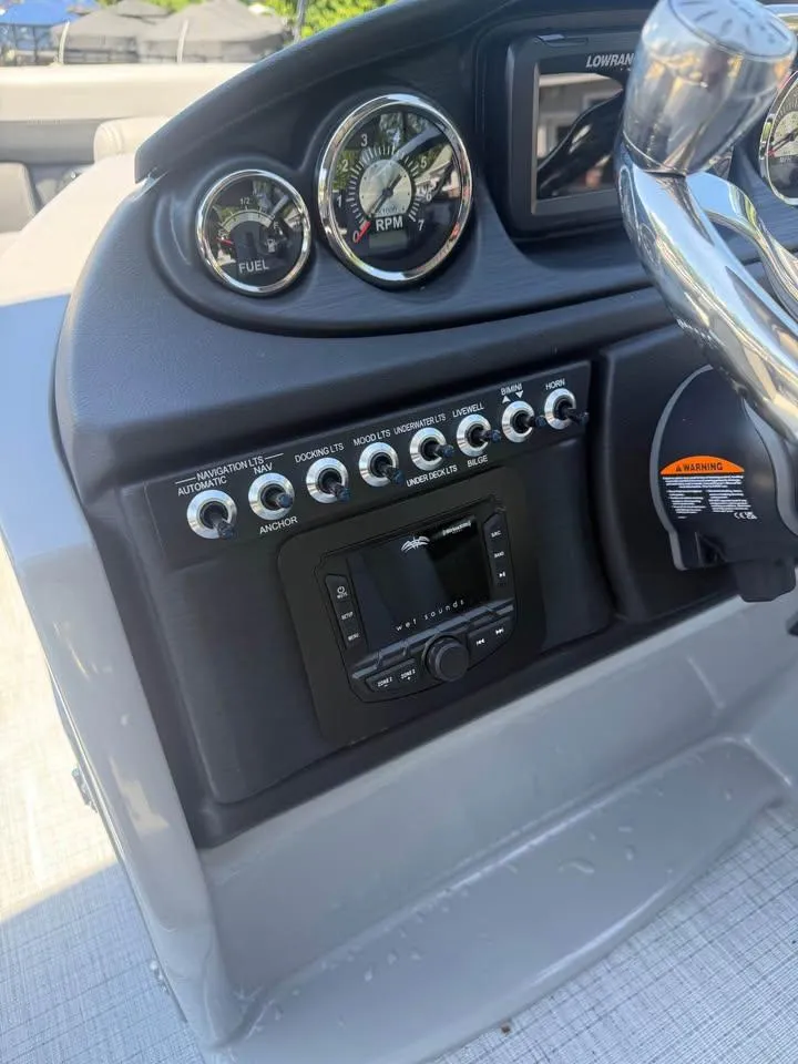 Slide: The Image of Dashboard of 2025 Berkshire 22RFX CTS boat with gauges and control panel. - 8