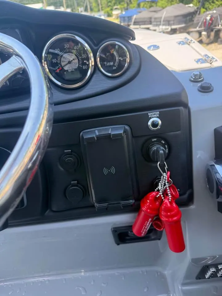 Slide: The Image of Dashboard of 2025 Berkshire 22RFX CTS boat with gauges and ignition keys. - 9