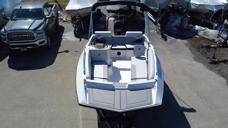 Slide: The Image of 2025 Starcraft SV 16 OB boat parked outdoors, viewed from above. - 2