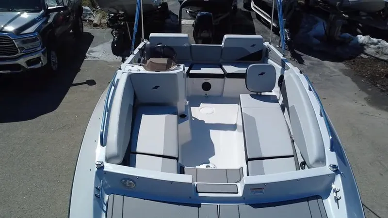 Slide: The Image of 2025 Starcraft SV 16 OB boat interior with seating and steering console. - 3