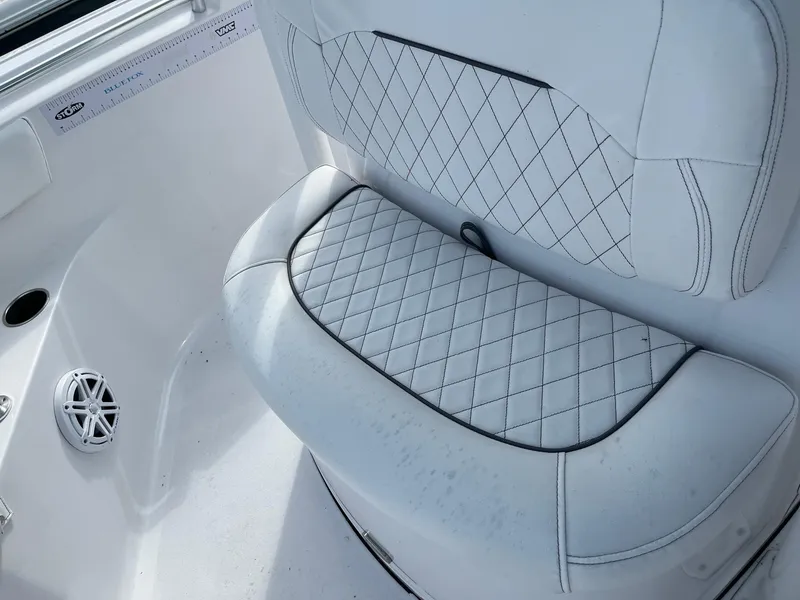 Slide: The Image of 2021 Sportsman Heritage 211 Center Console boat seat with diamond-stitched upholstery. - 14