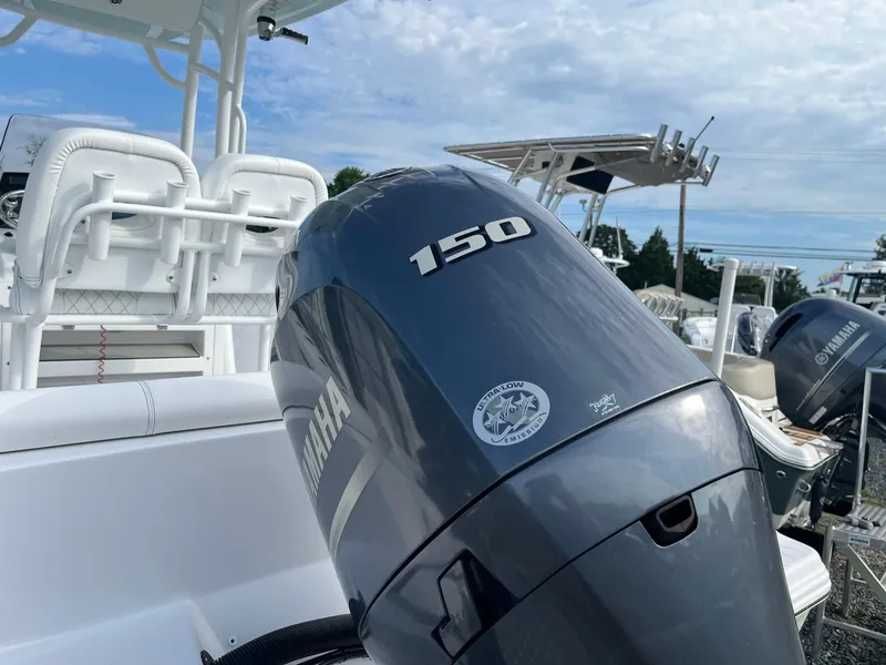 Slide: The Image of 2021 Sportsman Heritage 211 Center Console with Yamaha 150 outboard motor. - 7