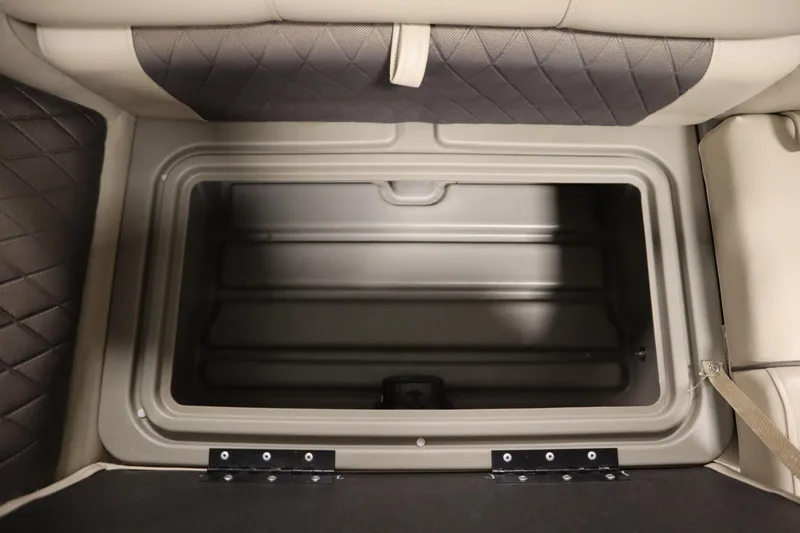 Slide: The Image of 2023 Tracker 20 DLX PARTY BARGE storage compartment with cushioned seating and durable construction. - 14