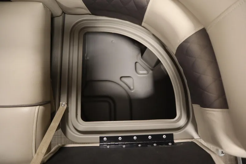 Slide: The Image of 2023 Tracker 20 DLX PARTY BARGE storage compartment with beige and gray seating. - 15
