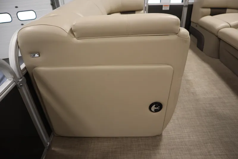 Slide: The Image of 2023 Tracker 20 DLX PARTY BARGE interior with beige seating and modern design. - 20