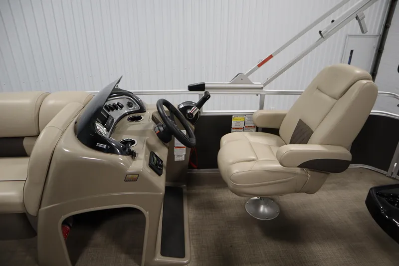 Slide: The Image of 2023 Tracker 20 DLX PARTY BARGE interior with steering console and captain's chair. - 22