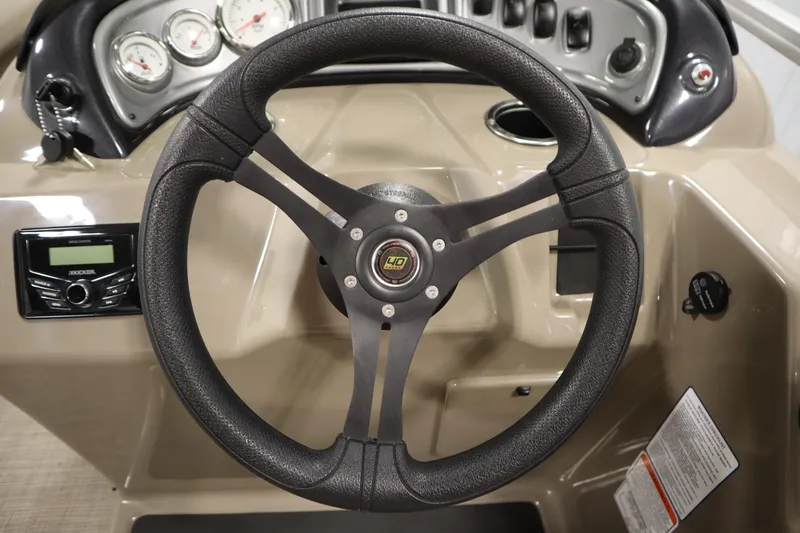 Slide: The Image of Steering wheel and dashboard of 2023 Tracker 20 DLX PARTY BARGE boat. - 25