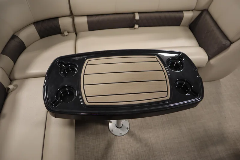 Slide: The Image of 2023 Tracker 20 DLX PARTY BARGE interior with table and cup holders. - 40
