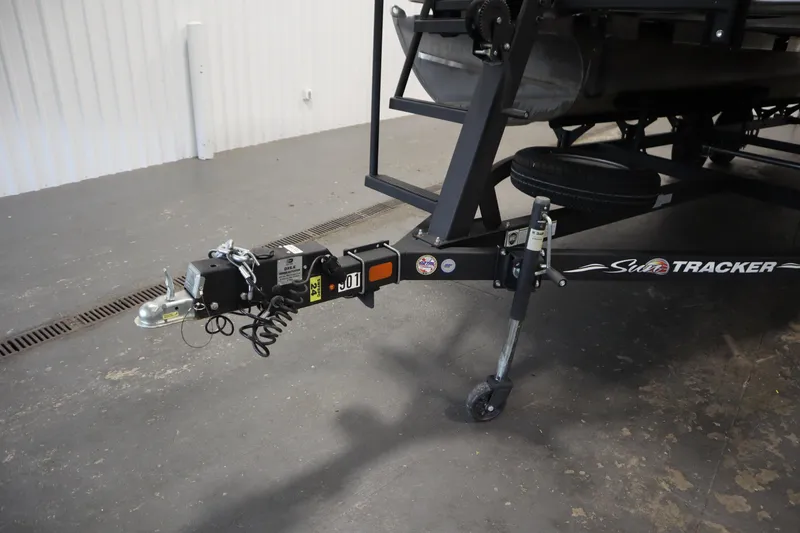 Slide: The Image of Trailer hitch of 2023 Tracker 20 DLX PARTY BARGE in a garage setting. - 49