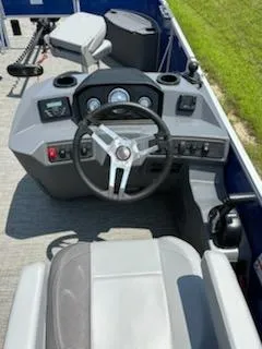 Slide: The Image of 2024 Bennington 20SVF boat dashboard with steering wheel and controls. - 10