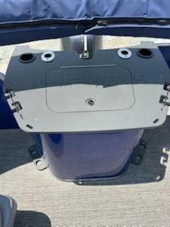 Slide: The Image of 2024 Bennington 20SVF boat console with cup holders and storage compartment. - 11