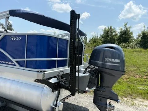 Slide: The Image of 2024 Bennington 20SVF pontoon boat with Yamaha outboard motor, parked outdoors. - 3