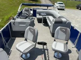 Slide: The Image of 2024 Bennington 20SVF pontoon boat with spacious seating and modern design. - 7