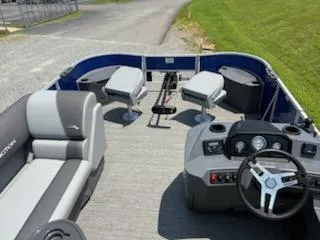 Slide: The Image of 2024 Bennington 20SVF pontoon boat interior with seating and steering console. - 9