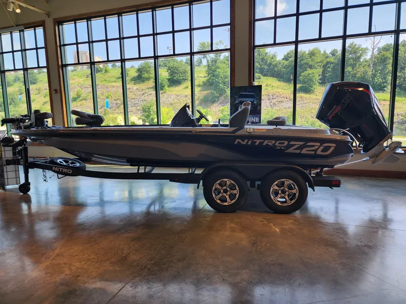 The Image of 2026 Nitro Z20 XL Pro boat displayed indoors with large windows in the background. - 1
