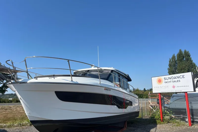 The Image of 2023 Jeanneau NC Weekender 1095 at Sundance Yacht Sales under clear blue sky. - 0