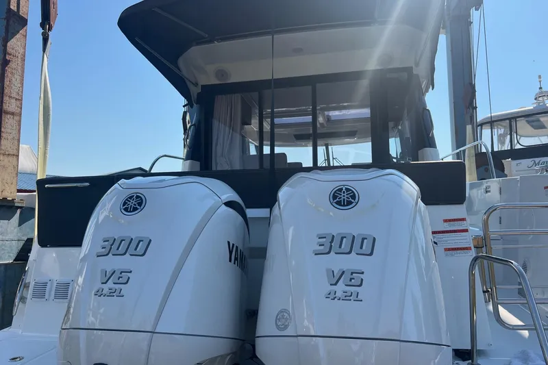 Slide: The Image of 2023 Jeanneau NC Weekender 1095 with twin Yamaha 300 V6 outboard engines. - 16