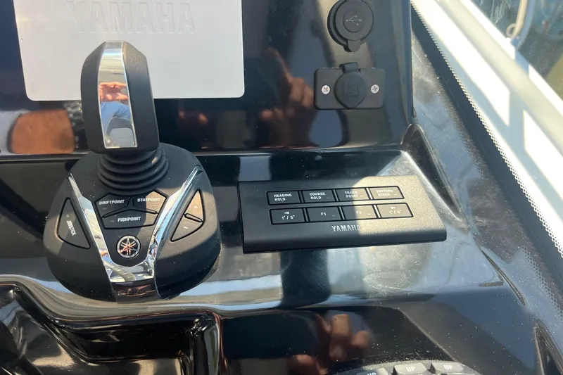 Slide: The Image of Control panel of 2023 Jeanneau NC Weekender 1095 with Yamaha joystick and buttons. - 26