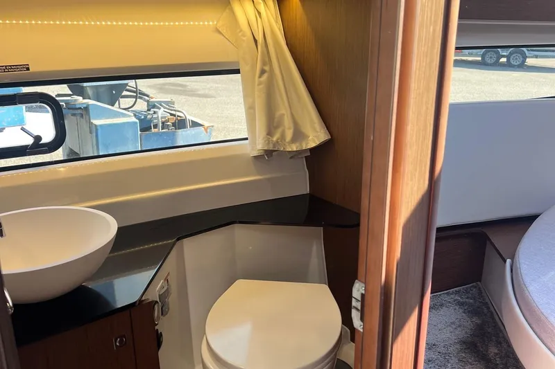 Slide: The Image of 2023 Jeanneau NC Weekender 1095 interior bathroom with sink and toilet. - 32