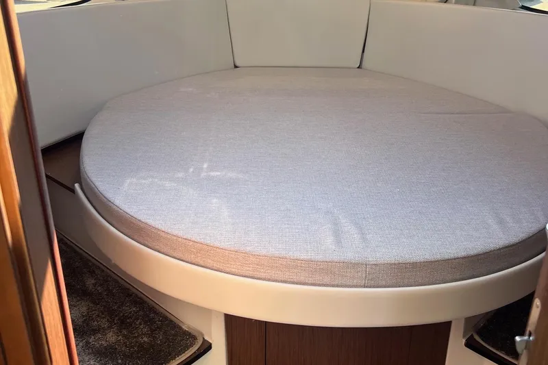 Slide: The Image of 2023 Jeanneau NC Weekender 1095 interior cabin with round bed. - 33