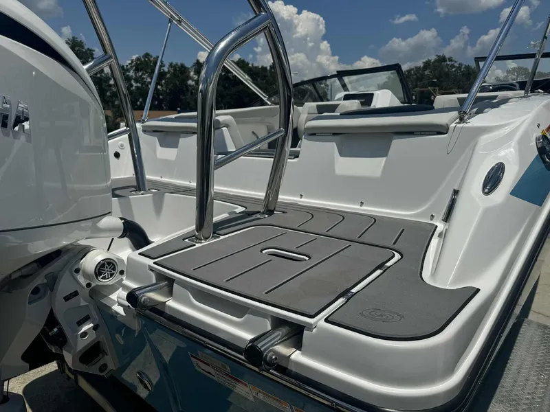 Slide: The Image of Cup holders on 2026 Hurricane SunDeck 2050 OB boat, featuring sleek stainless steel design. - 10