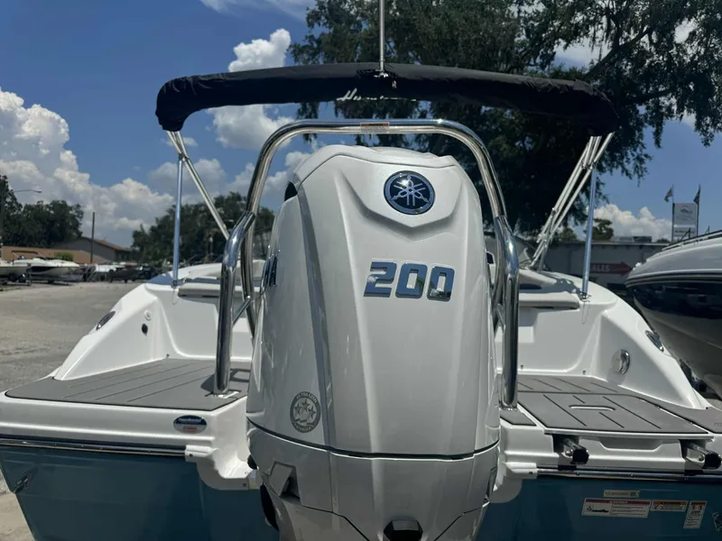 Slide: The Image of 2026 Hurricane SunDeck 2050 OB boat deck with sleek design and stainless steel railings. - 11