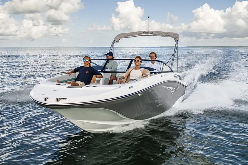 Slide: The Image of 2026 Hurricane SunDeck 2050 OB boat interior with spacious seating and cup holders. - 13