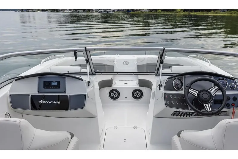 Slide: The Image of 2026 Hurricane SunDeck 2050 OB boat interior with spacious seating and modern dashboard. - 15