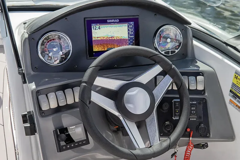 Slide: The Image of 2026 Hurricane SunDeck 2050 OB boat interior with sleek dashboard and seating. - 16