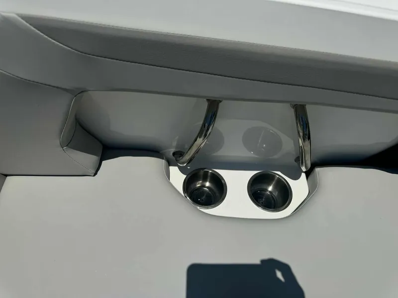 Slide: The Image of 2026 Hurricane SunDeck 2050 OB boat, blue hull, sleek design, close-up view. - 3