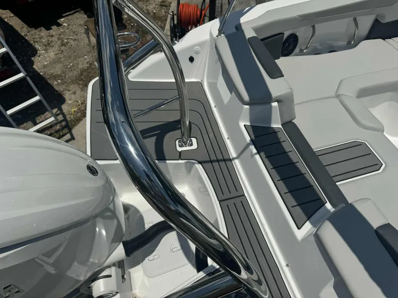 Slide: The Image of 2026 Hurricane SunDeck 2050 OB boat, close-up view with sleek design details. - 4