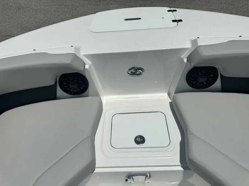 Slide: The Image of 2026 Hurricane SunDeck 2050 OB boat on trailer under a sunny sky. - 5