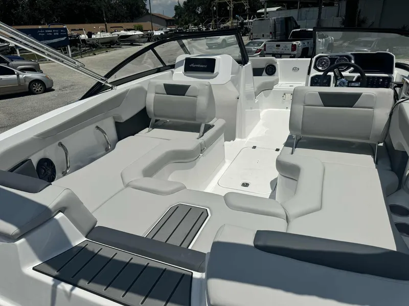 Slide: The Image of 2026 Hurricane SunDeck 2050 OB dashboard with steering wheel and control panel. - 8