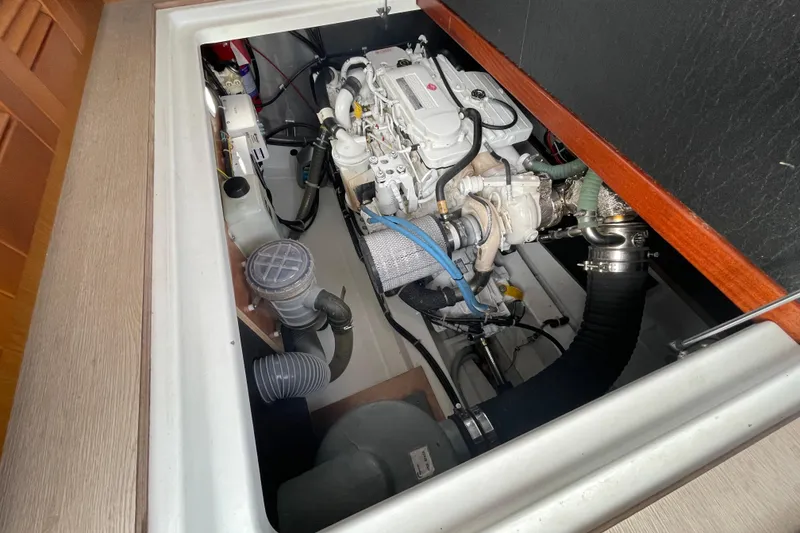 Slide: The Image of Engine compartment of 2018 Beneteau Swift Trawler 35, showcasing mechanical components. - 103