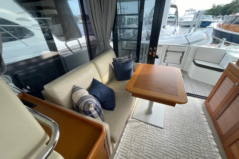 Slide: The Image of Interior of 2018 Beneteau Swift Trawler 35 with cozy seating and wooden table. - 28