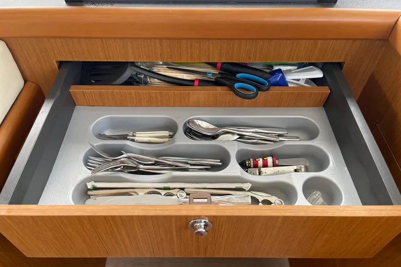 Slide: The Image of Drawer with organized cutlery and utensils on a 2018 Beneteau Swift Trawler 35. - 45