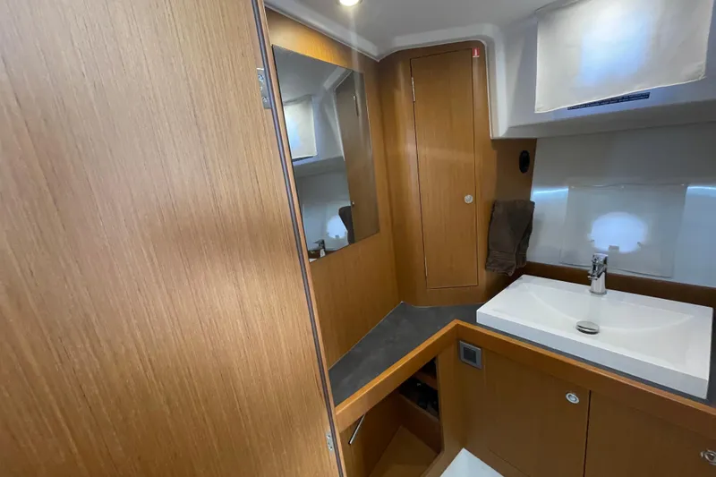 Slide: The Image of 2018 Beneteau Swift Trawler 35 bathroom with wooden cabinetry and modern sink. - 69