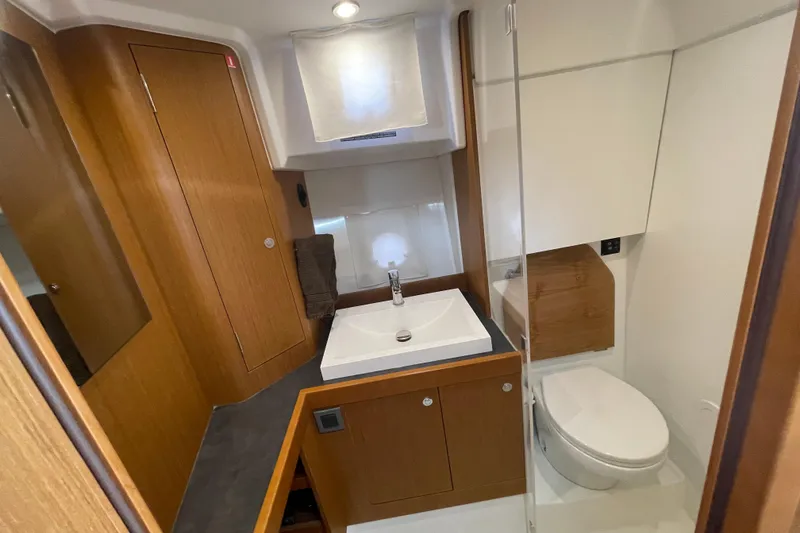 Slide: The Image of Bathroom interior of 2018 Beneteau Swift Trawler 35, featuring modern sink and toilet. - 72