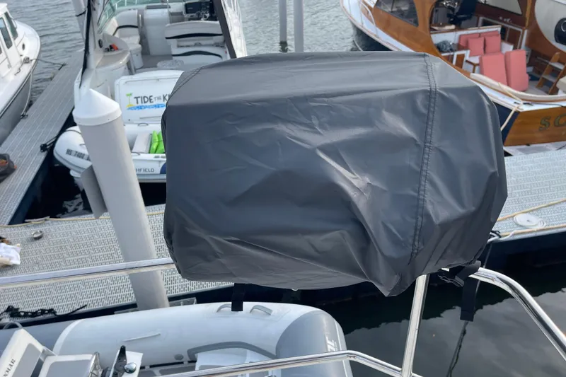 Slide: The Image of Covered equipment on a 2018 Beneteau Swift Trawler 35 at a marina. - 77