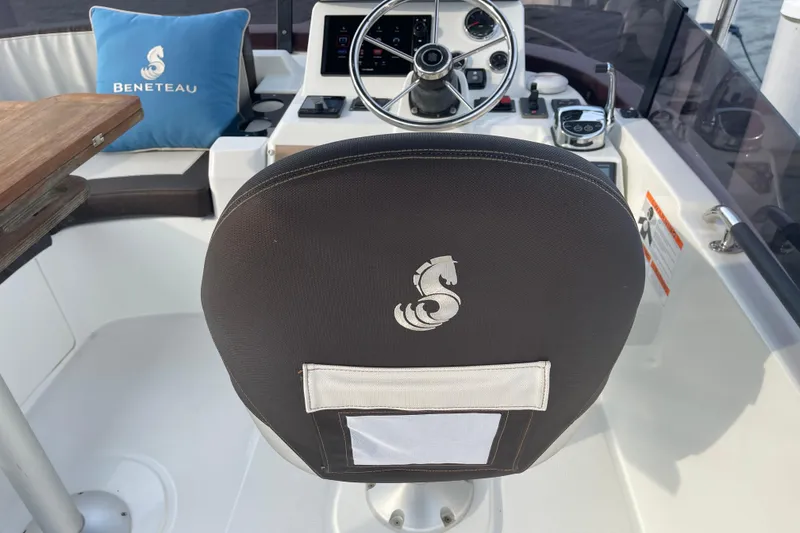 Slide: The Image of Beneteau Swift Trawler 35 helm with branded seat and steering wheel, 2018 model. - 85