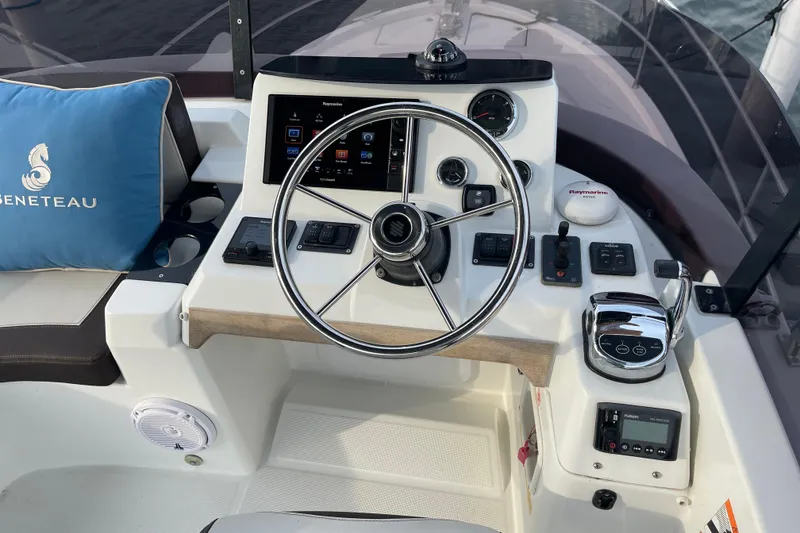 Slide: The Image of Helm of 2018 Beneteau Swift Trawler 35 with steering wheel and navigation controls. - 92
