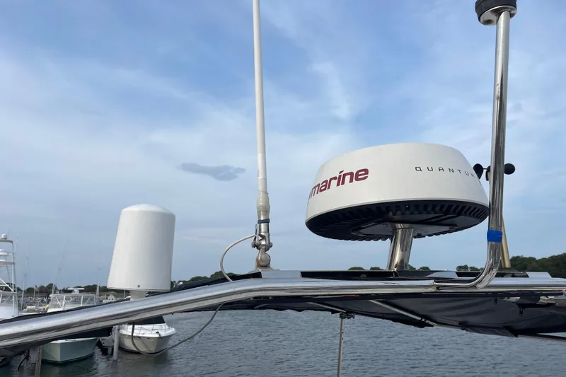 Slide: The Image of Radar equipment on a 2018 Beneteau Swift Trawler 35 against a cloudy sky. - 93