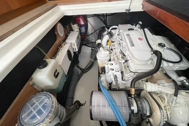 Slide: The Image of Engine compartment of a 2018 Beneteau Swift Trawler 35, showcasing mechanical components. - 97