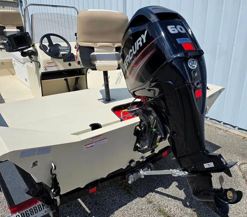 Slide: The Image of 2015 SeaArk RX18 Center Console boat with Mercury 60 outboard motor. - 10